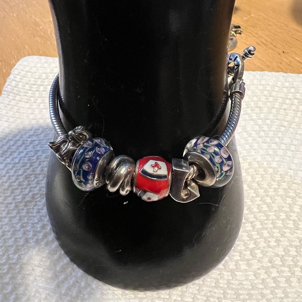Chamilia Sterling silver charm bracelet. Chamilia beads are made by Swarovski.